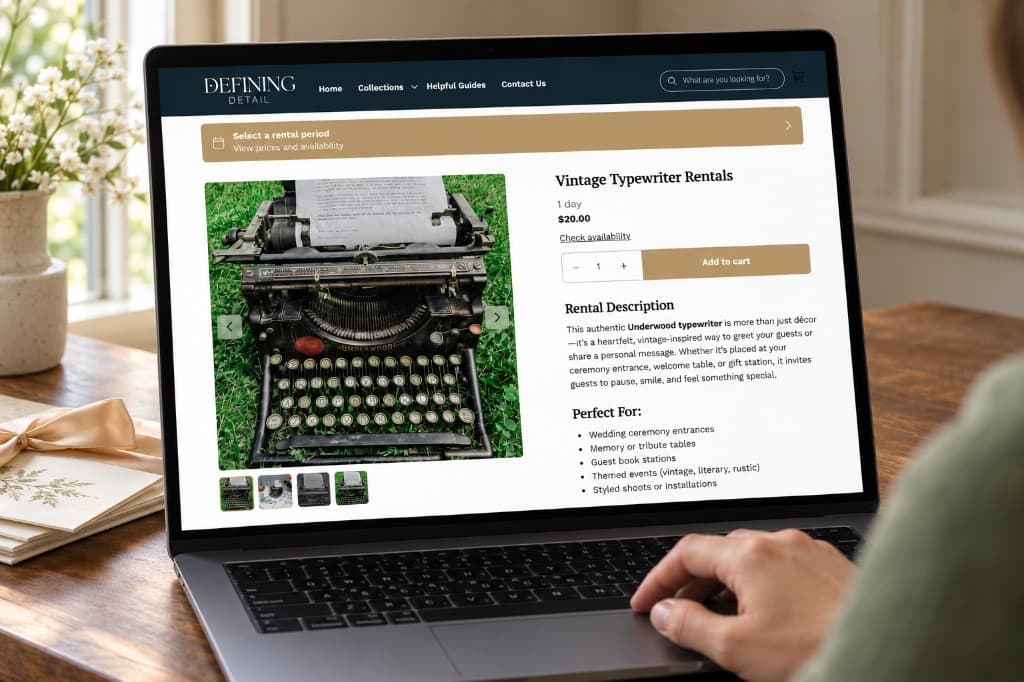 Someone using a laptop that shows a Defining Detail product page: a vintage typewriter photograph beside rental details and add-to-cart controls.