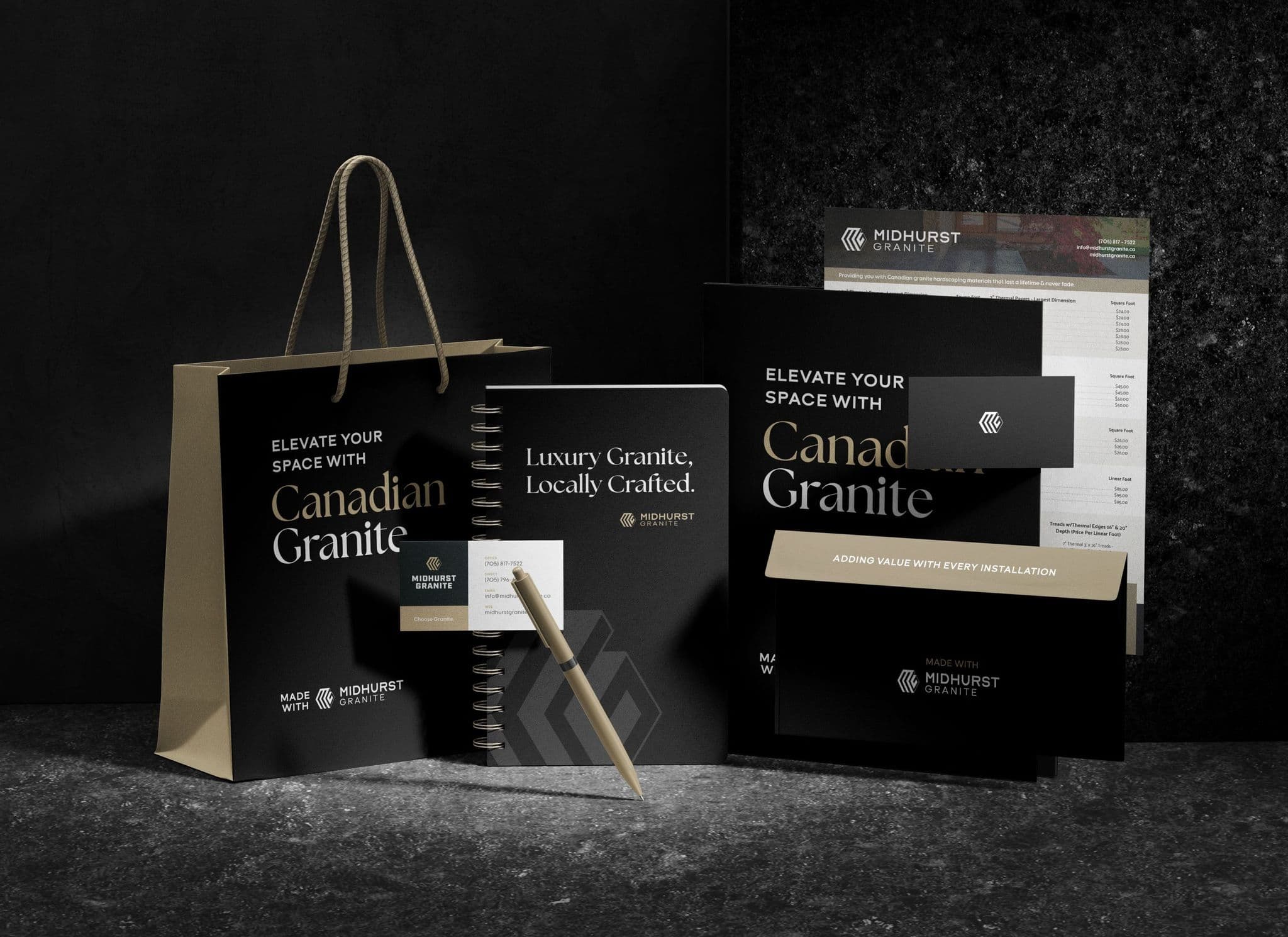 Midhurst Granite stationery set in black and gold: a shopping bag and notebook reading Elevate Your Space with Canadian Granite, business cards, a folder, an envelope, and a product sheet on a dark stone surface.