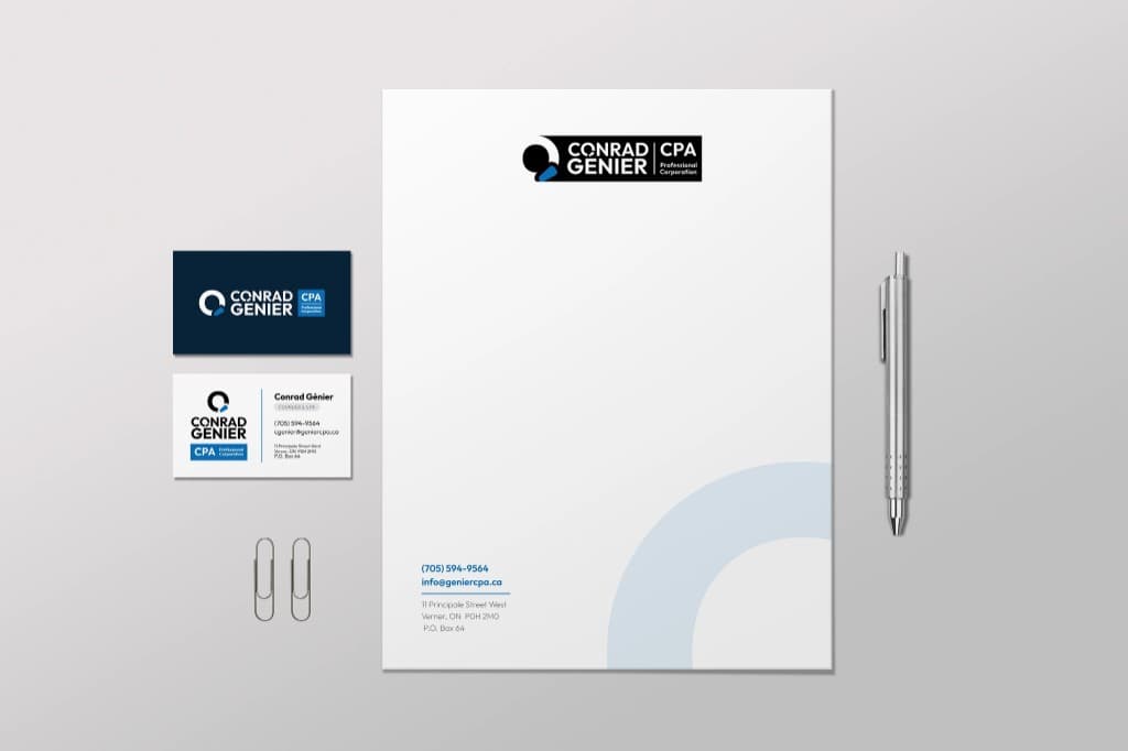 Conrad Genier CPA stationery set: letterhead with the horizontal logo at top and a pale blue arc at the corner, navy and white business cards, paper clips, and a pen.