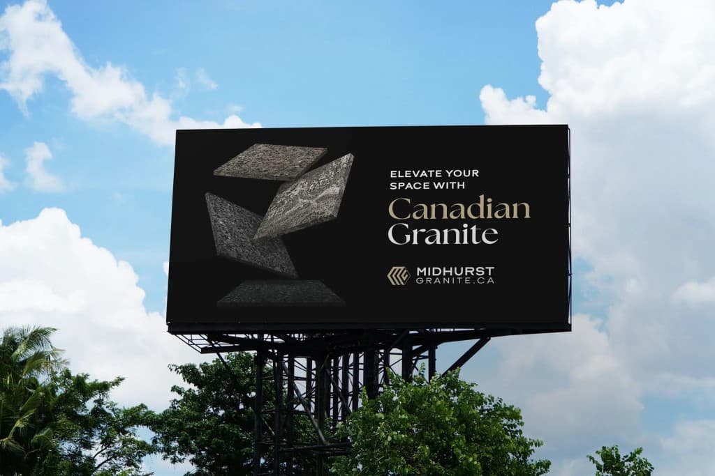 Roadside billboard against a blue sky: on black, four floating granite slabs beside the words Elevate Your Space with Canadian Granite and the Midhurst Granite logo.